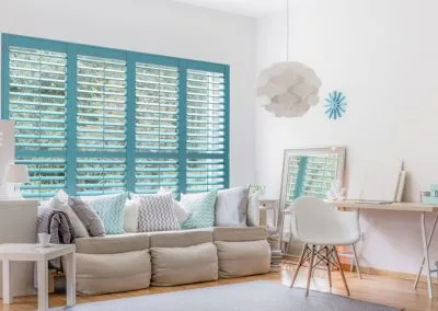 Teal painted wood shutters for a fun look