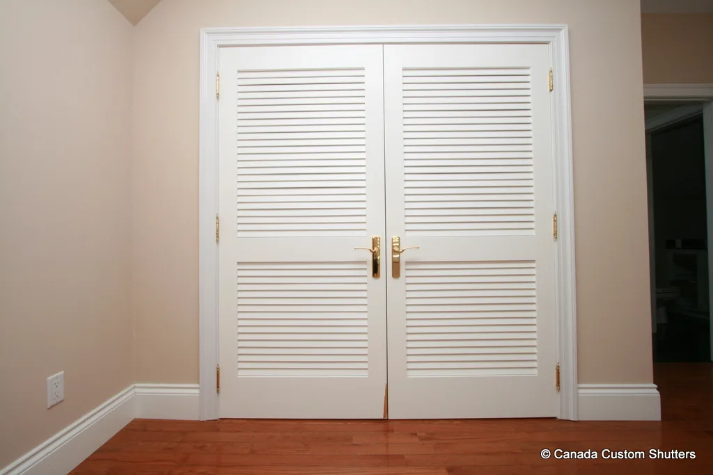 Louvered closet doors with premium hardware