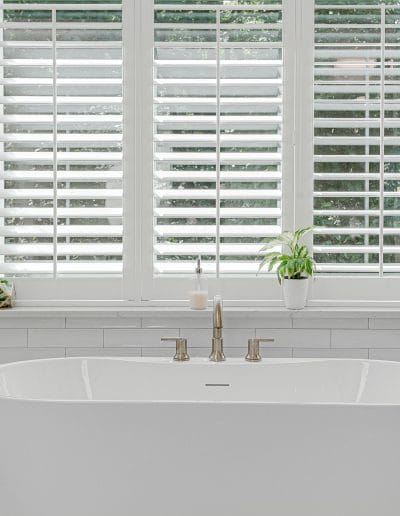 Modern,luxury,soaking,tub,with,brass,faucet,interior,design,staged