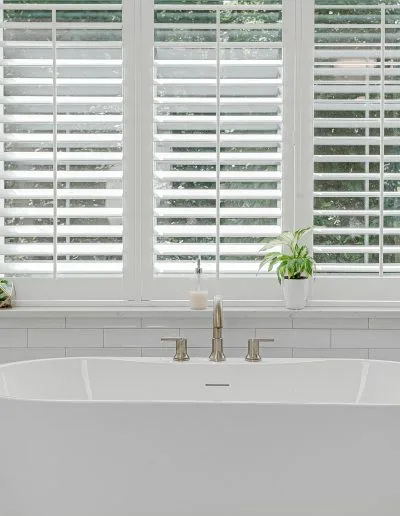 Modern,luxury,soaking,tub,with,brass,faucet,interior,design,staged